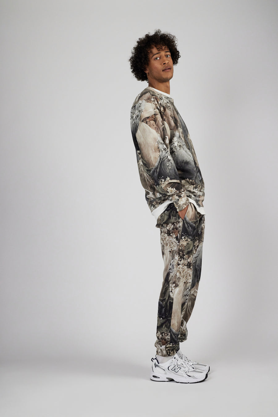 Man wearing an allover printed track suit