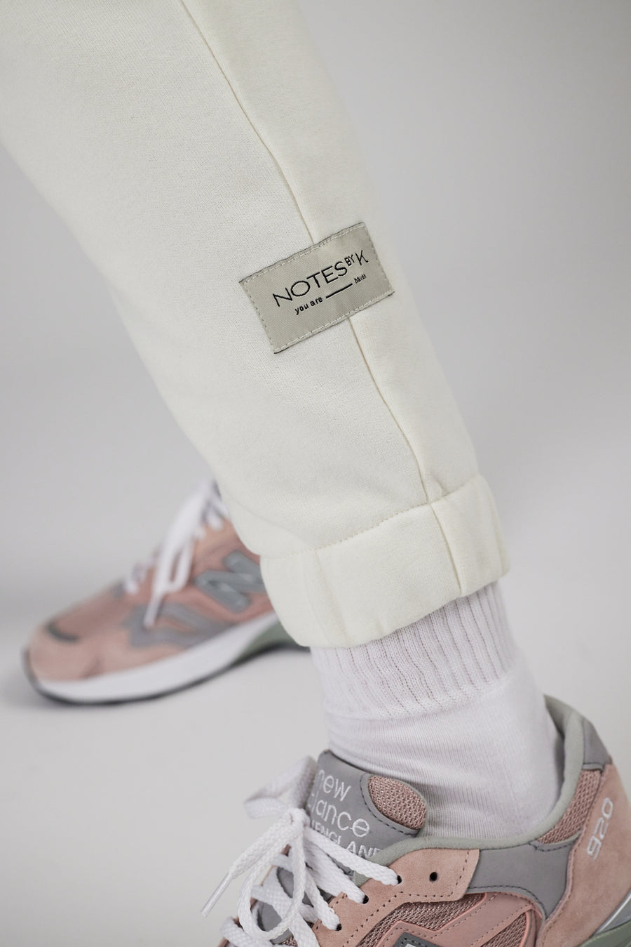 Labeling detail on sweatpants in color eggnog
